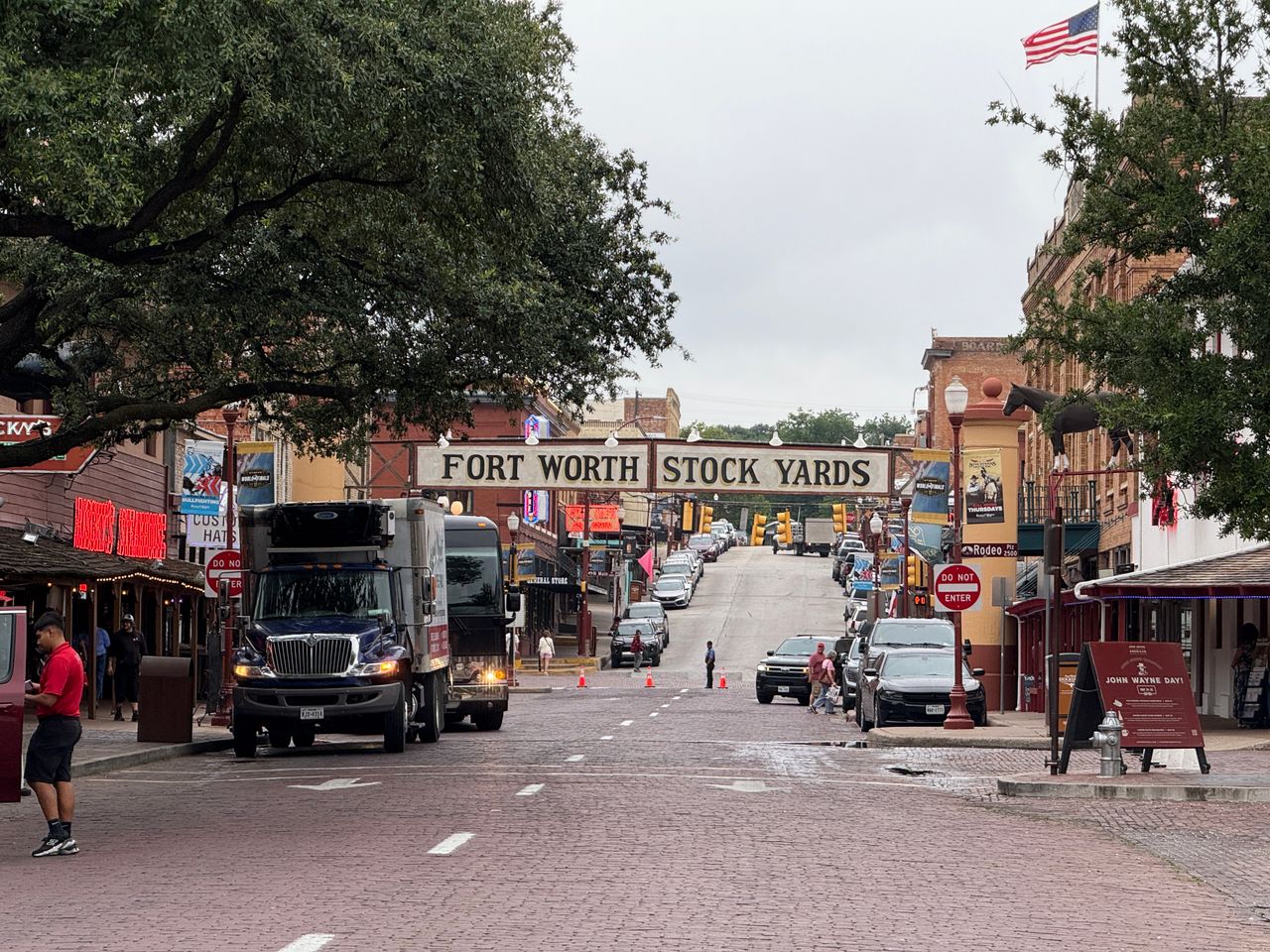 Fort Worth Stockyards sign over a brick street