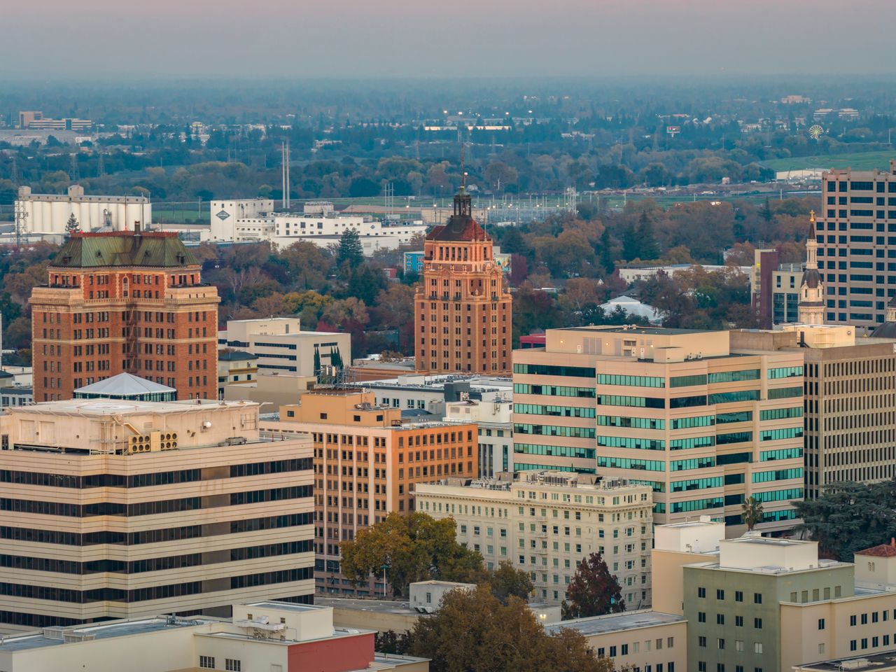 Downtown buildings and treetops on a cloudy day