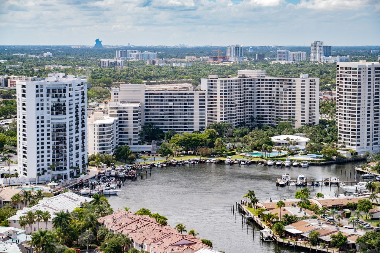 High-rise apartments along a marina and canals, seen from above
