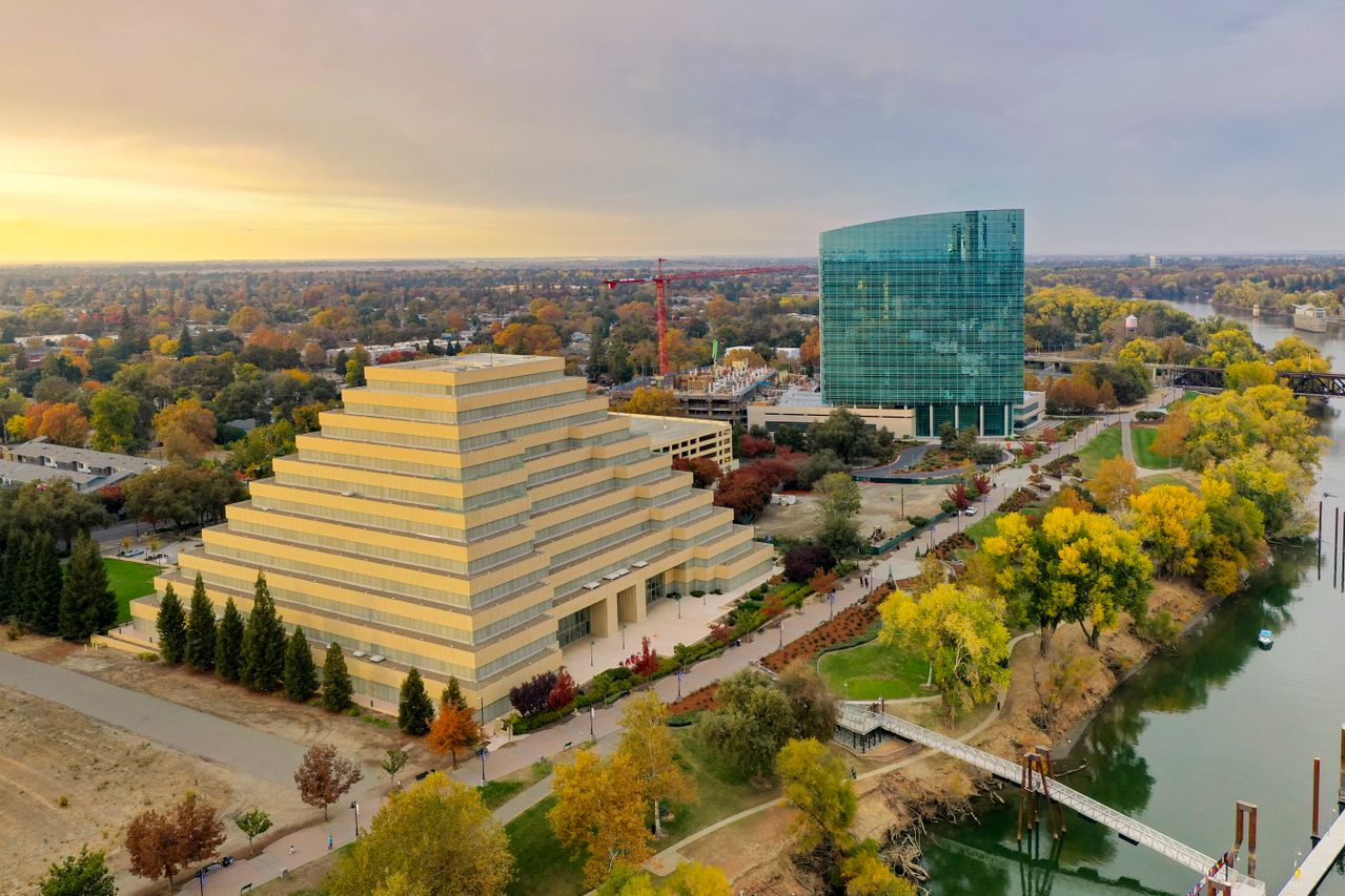 Ziggurat building beside the Sacramento River in autumn