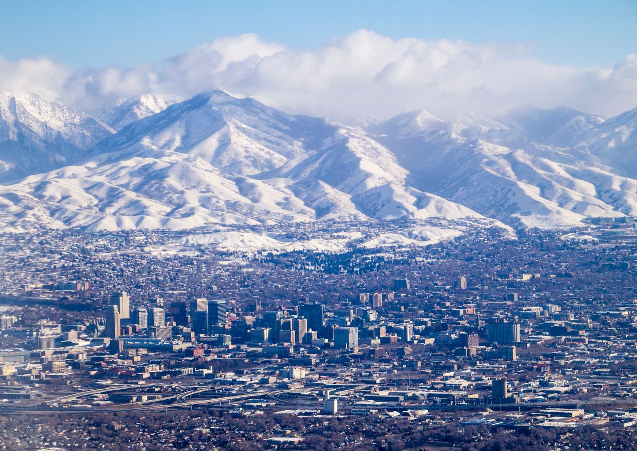 Salt Lake City below snow-covered mountains