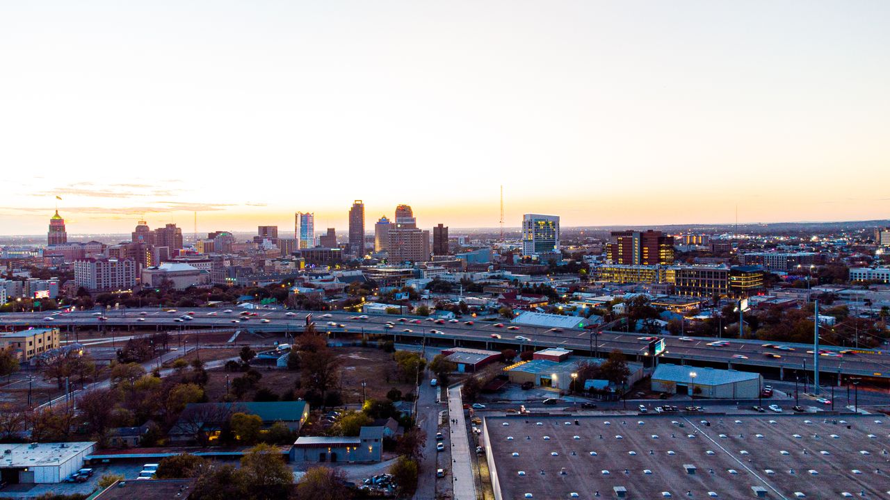 San Antonio skyline at sunset with highways in the foreground