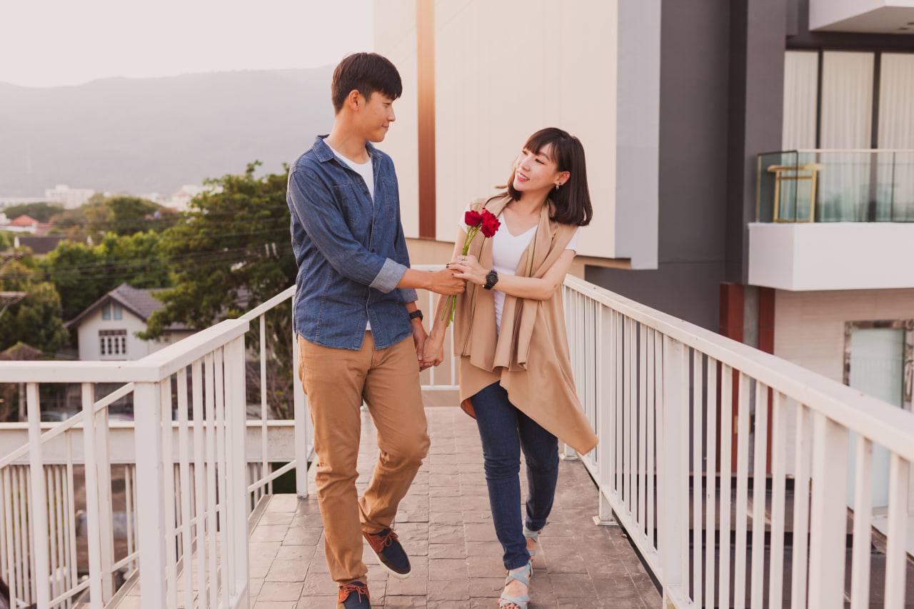 oyful happy couple on a romantic night date, exploring the world of asian men online dating.