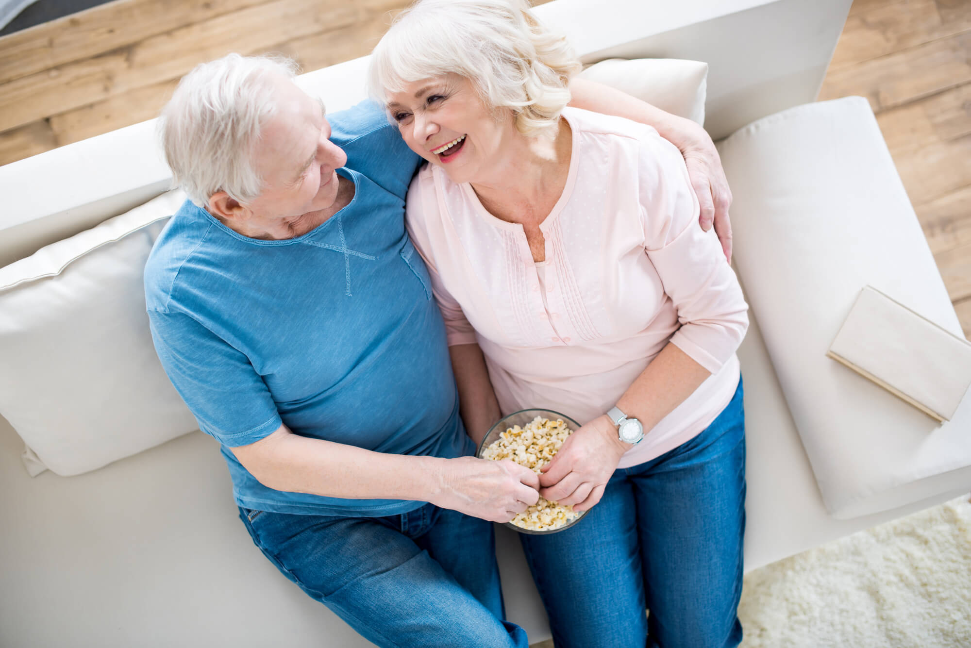 couple over 70 relaxing on the couch